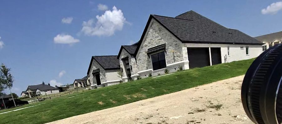 New stone-and-brick home shot by Brax